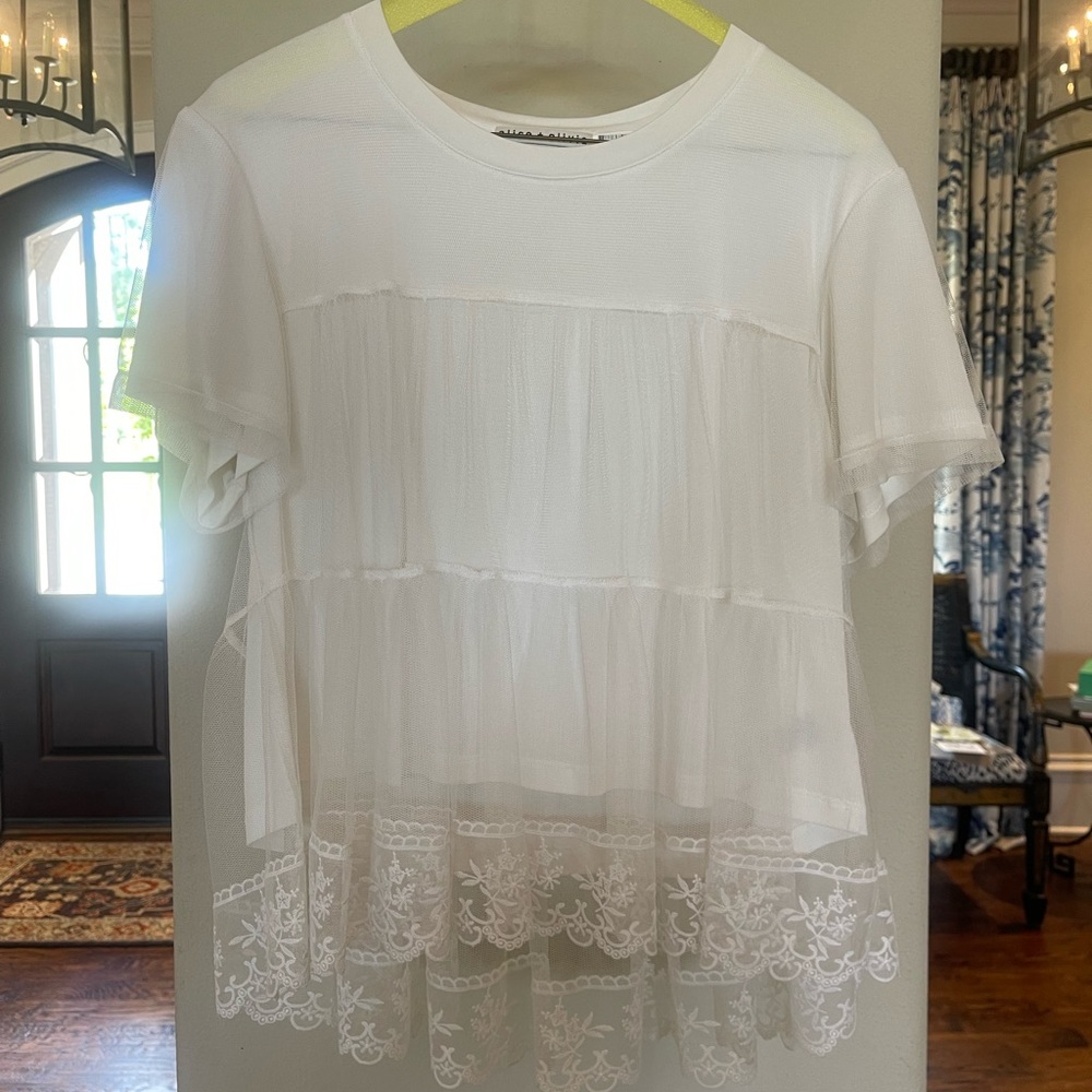 Tiers of tulle are layered atop a perfectly-cut T-shirt with added lace accents.